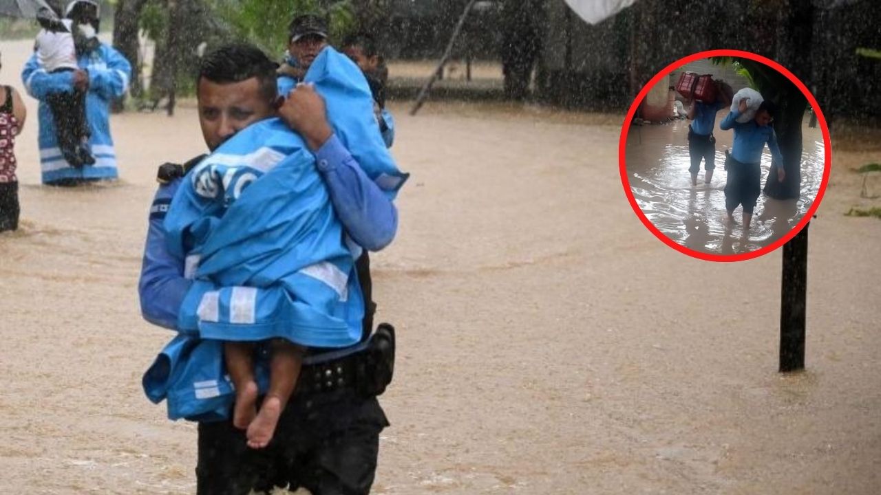 Bajo la lluvia, policías rescatan a menores que corrían peligro por inundaciones Imagen de Bajo la lluvia, policías rescatan a menores que corrían peligro por inundaciones