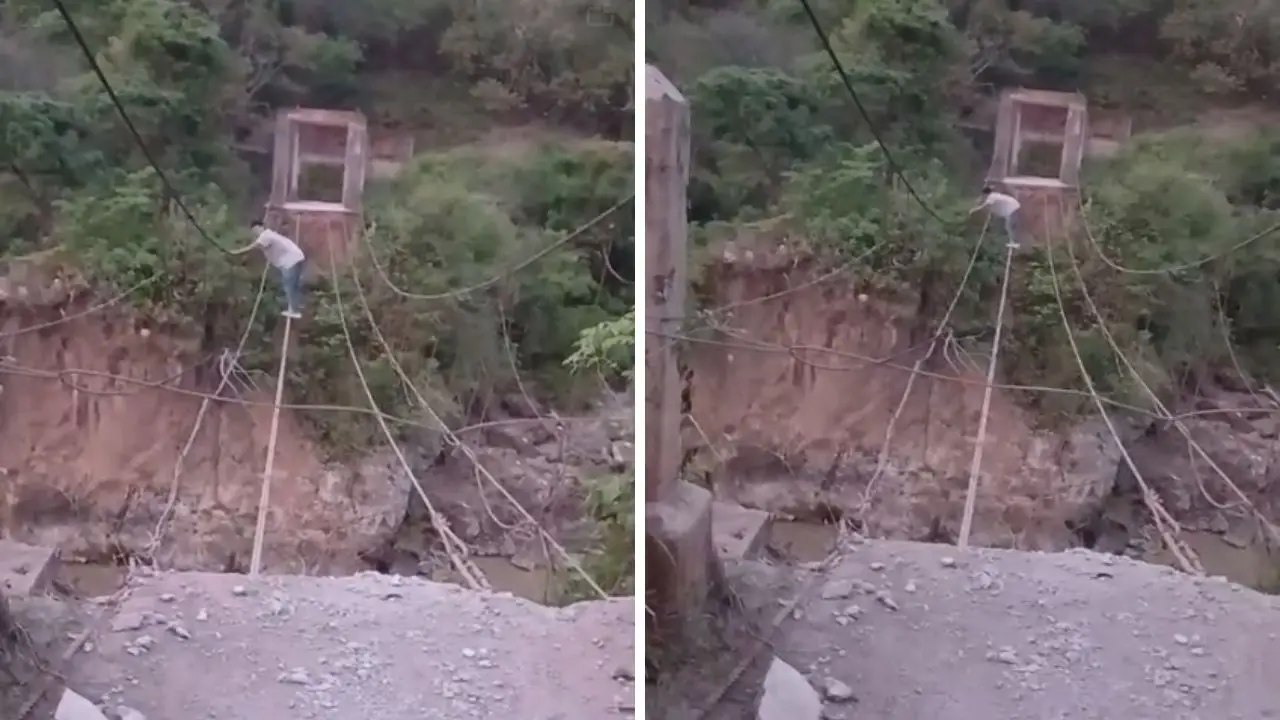 Imagen de Video: Hombre desafía el peligro cruzando río sobre cables para no mojarse en Lempira
