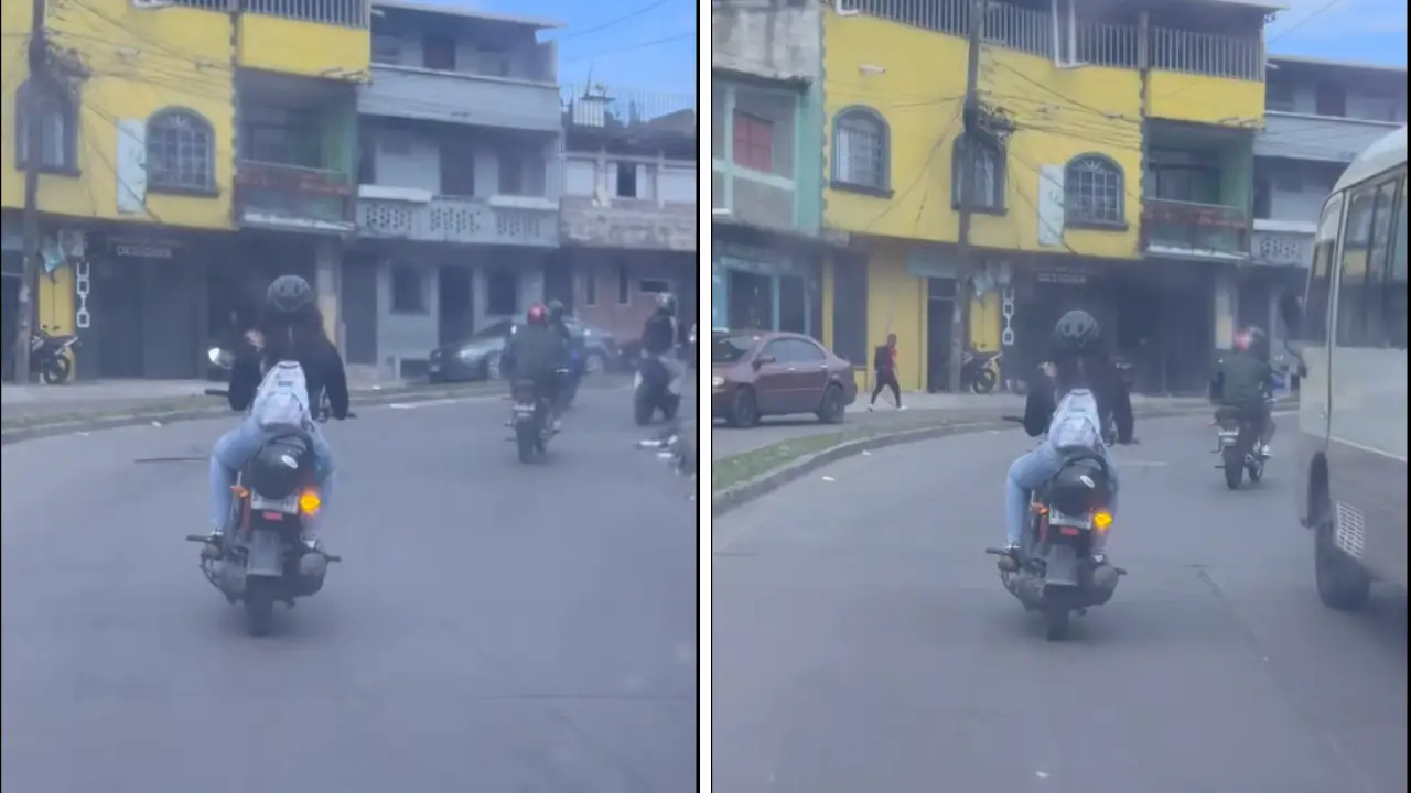 Captan a mujer conduciendo motocicleta mientras usa su teléfono celular Imagen de Captan a mujer conduciendo motocicleta mientras usa su teléfono celular