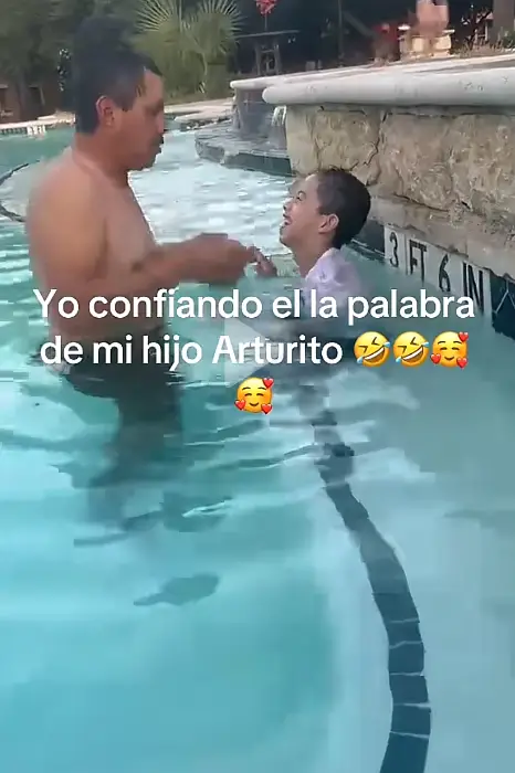 migrante hondureño junto a su hijo
